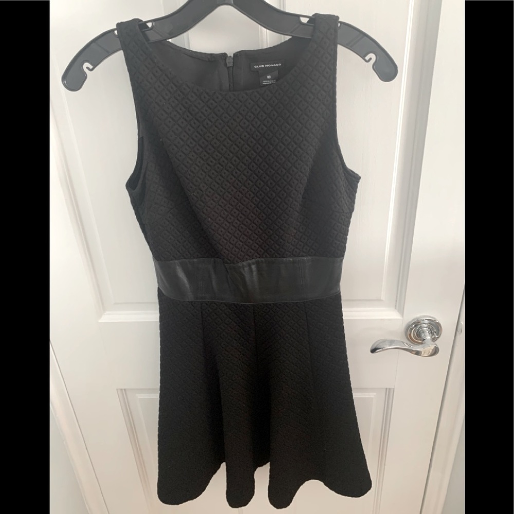 Black sleeveless dress with leather waist ban